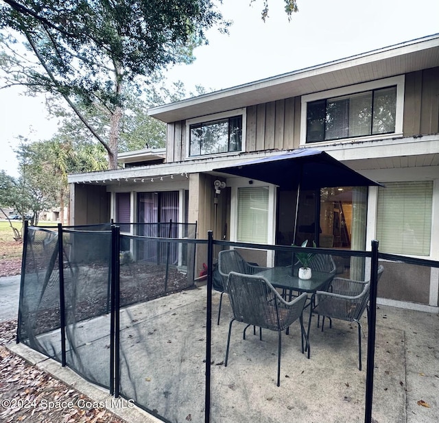 back of property featuring a patio area