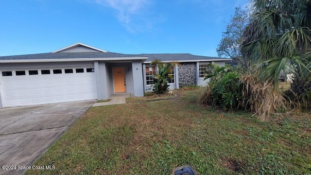 ranch-style home with a front yard and a garage