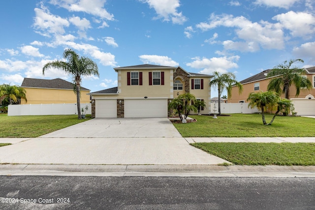 view of front of property featuring a garage and a front lawn