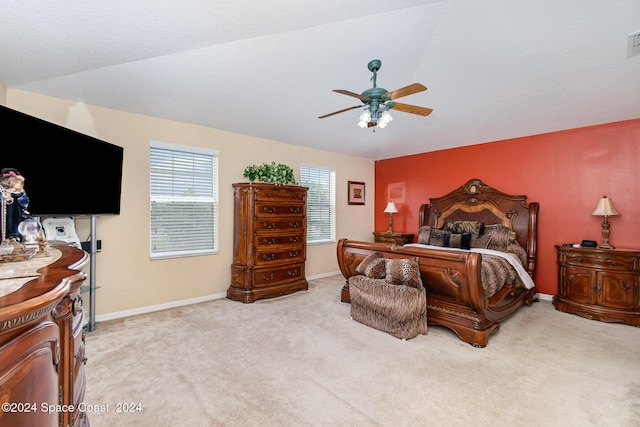 bedroom featuring light colored carpet and ceiling fan