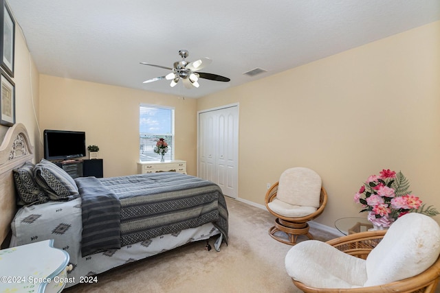 bedroom featuring carpet floors, a closet, and ceiling fan