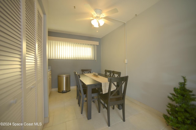 dining room with ceiling fan and light tile patterned flooring