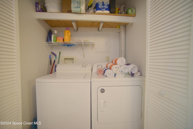 washroom featuring washer and dryer