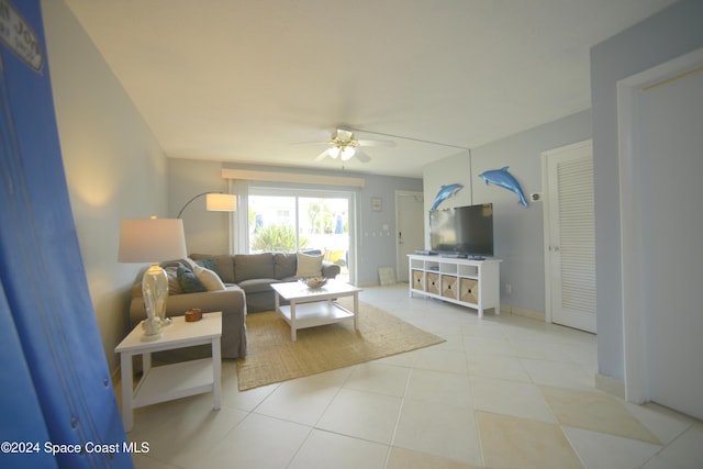 tiled living room featuring ceiling fan