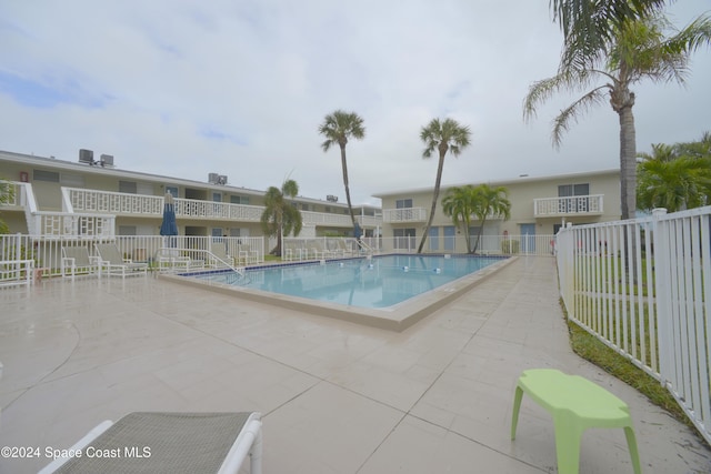 view of swimming pool featuring a patio area