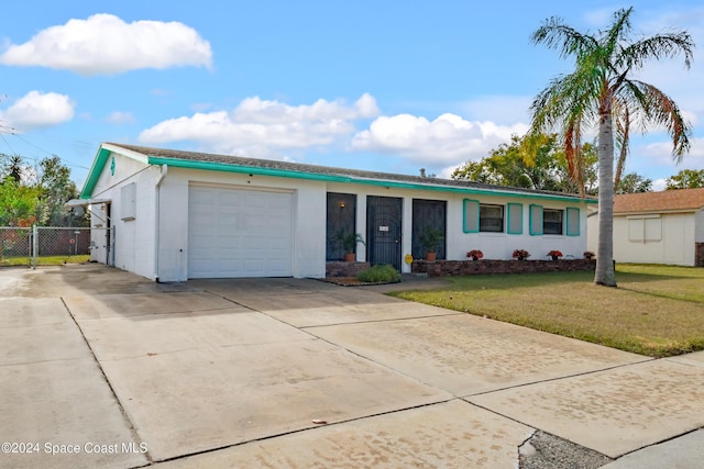 ranch-style home featuring a garage and a front lawn