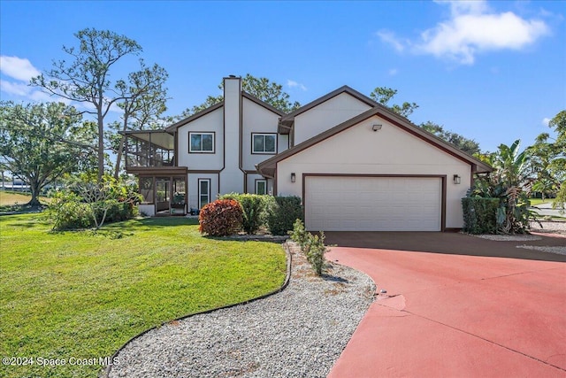 view of front of home with a front yard and a sunroom