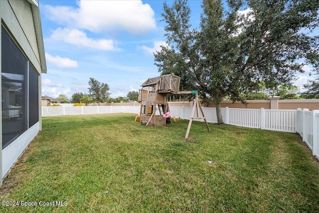 view of yard with a playground