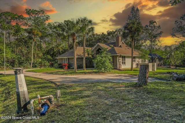 ranch-style house featuring a yard