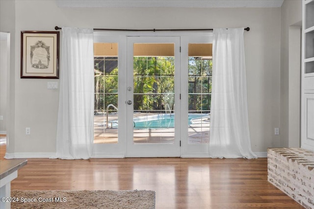 doorway to outside featuring french doors and wood-type flooring