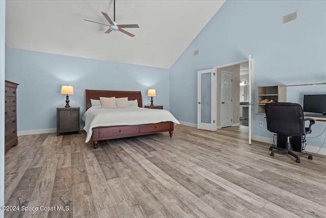 bedroom featuring french doors, light hardwood / wood-style flooring, high vaulted ceiling, and ceiling fan