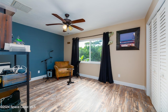 office space featuring hardwood / wood-style flooring and ceiling fan