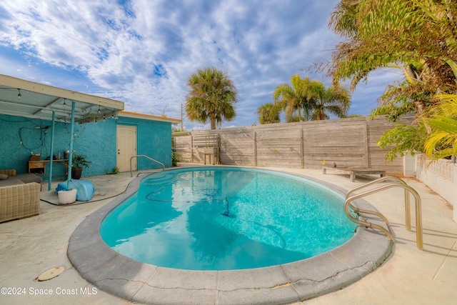 view of pool featuring a patio area