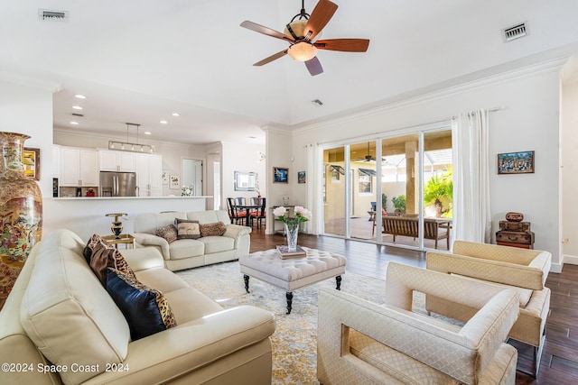 living room with hardwood / wood-style flooring, ceiling fan, and ornamental molding