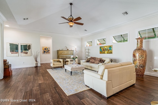 living room featuring ornamental molding, vaulted ceiling, and a healthy amount of sunlight