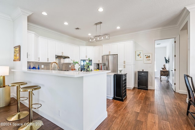 kitchen with white cabinetry, hanging light fixtures, dark hardwood / wood-style floors, stainless steel refrigerator with ice dispenser, and decorative backsplash