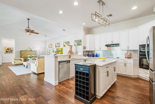 kitchen with pendant lighting, black appliances, white cabinets, a kitchen island, and kitchen peninsula