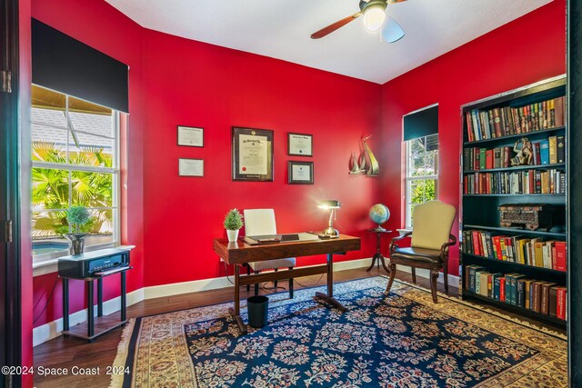 home office featuring ceiling fan, wood-type flooring, and a wealth of natural light