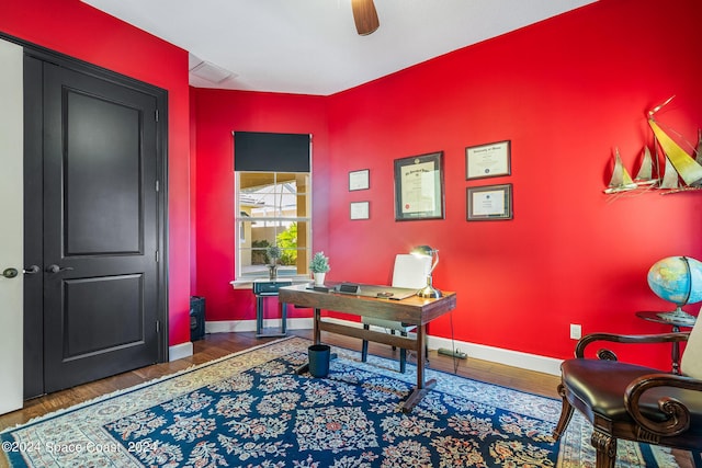 office featuring wood-type flooring and ceiling fan