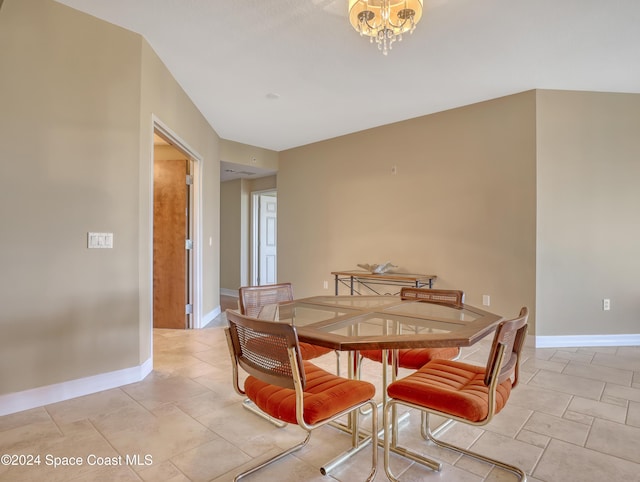 dining space with a notable chandelier