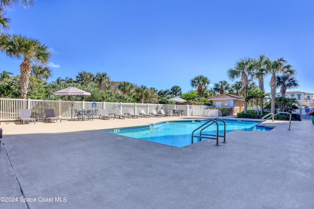 view of swimming pool with a patio area