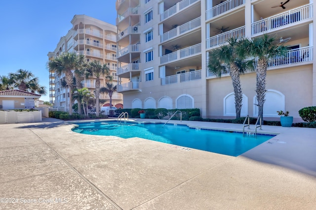 view of swimming pool featuring a patio area