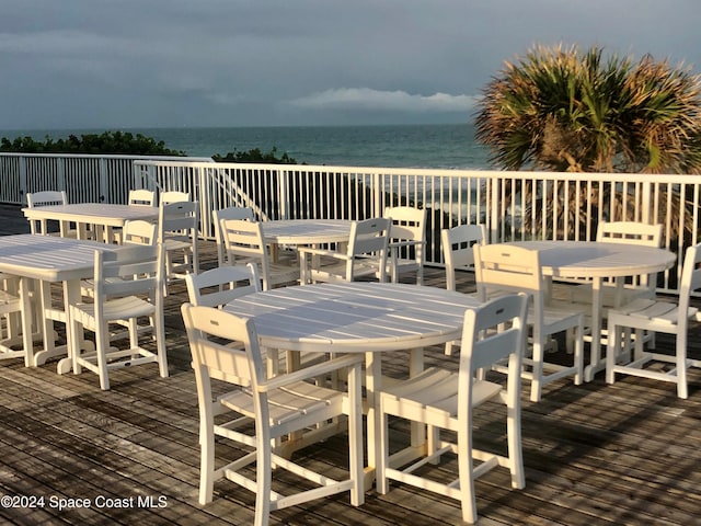 wooden deck featuring a water view