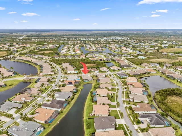 bird's eye view with a water view