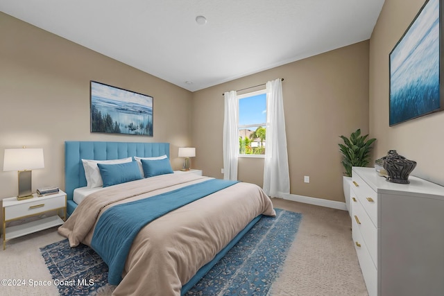 bedroom with light colored carpet