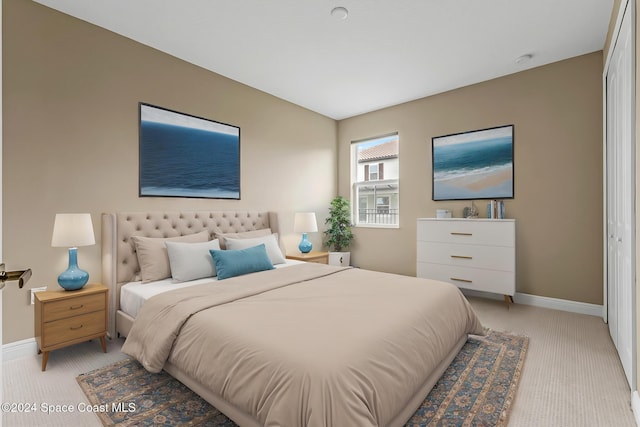 carpeted bedroom with a closet