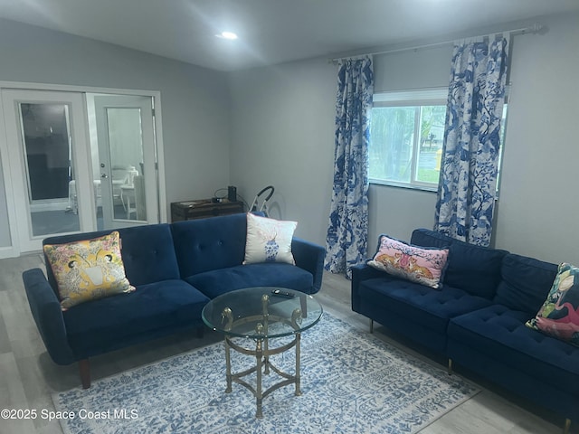 living room with wood finished floors and recessed lighting
