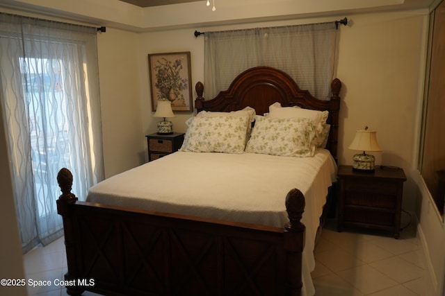 bedroom with light tile patterned flooring