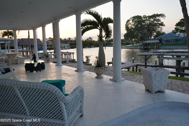 patio terrace at dusk with a water view