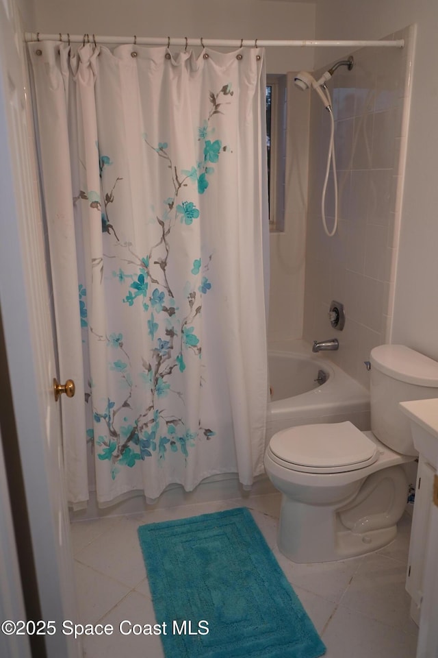 full bath with shower / bath combo with shower curtain, tile patterned floors, toilet, and vanity