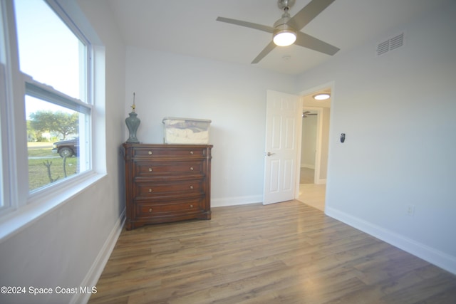 bedroom featuring hardwood / wood-style floors and ceiling fan