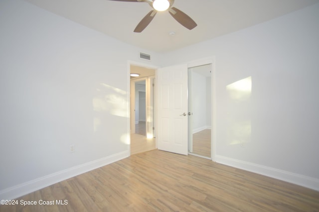 spare room featuring ceiling fan and light hardwood / wood-style flooring