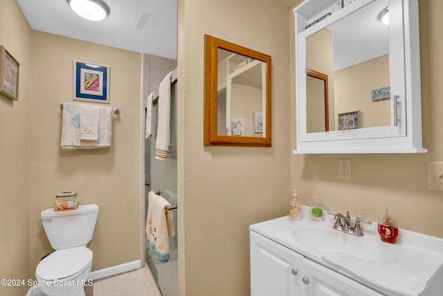 bathroom with walk in shower, tile patterned flooring, vanity, and toilet