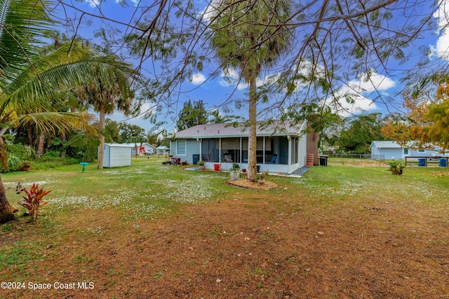 view of yard with a sunroom