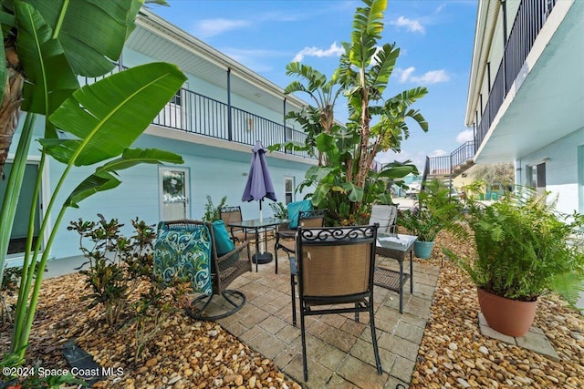 view of patio with a balcony