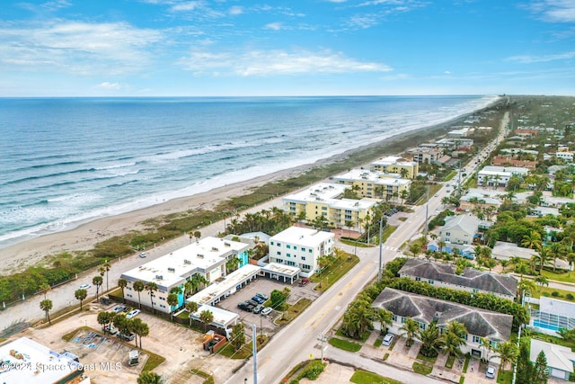 drone / aerial view with a view of the beach and a water view