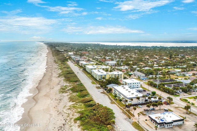 bird's eye view featuring a water view and a view of the beach