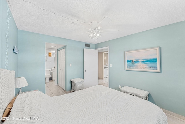 bedroom featuring connected bathroom, ceiling fan, light tile patterned floors, and a textured ceiling