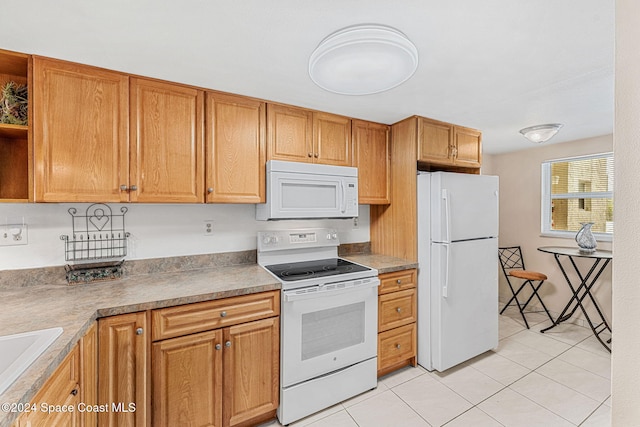 kitchen featuring white appliances and light tile patterned floors