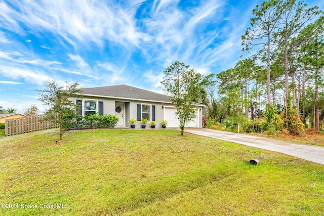 ranch-style home with a front yard and a garage