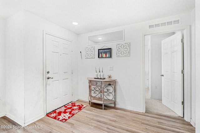 foyer entrance featuring light hardwood / wood-style flooring