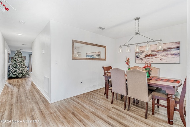 dining space with light hardwood / wood-style flooring