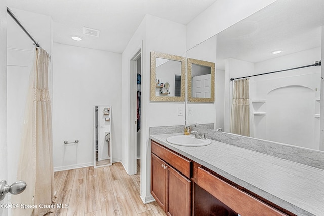 bathroom featuring vanity and wood-type flooring