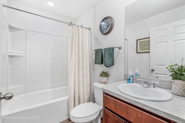 full bathroom featuring vanity, toilet, and shower / tub combo with curtain