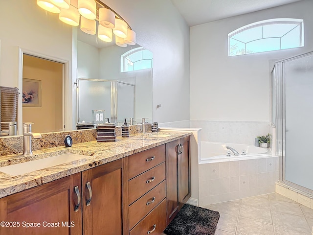 bathroom with tile patterned floors, vanity, and independent shower and bath