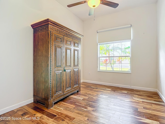 bedroom with ceiling fan and hardwood / wood-style floors